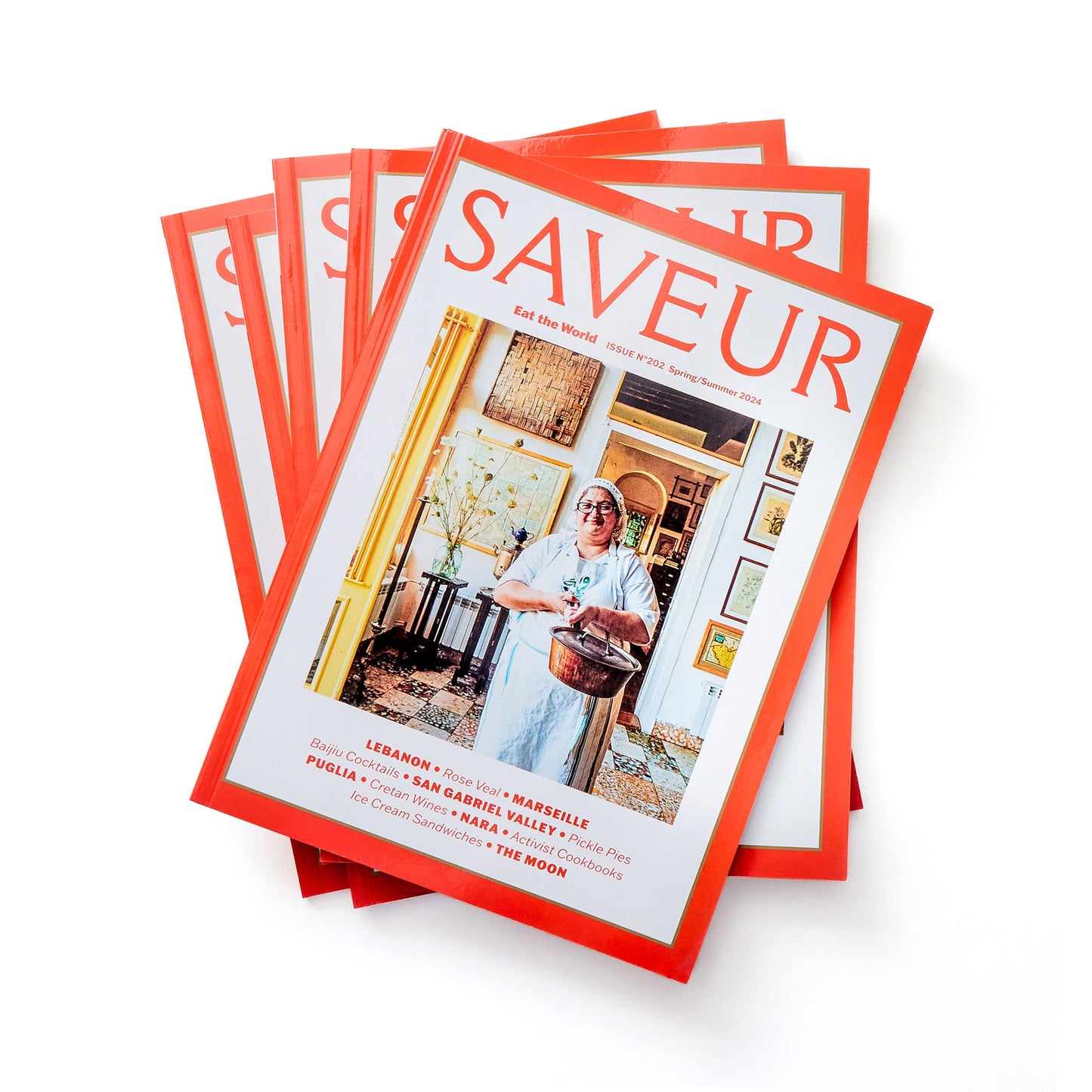 Stack of SAVEUR magazines issue No. 202; Spring/Summer 2024, on white background